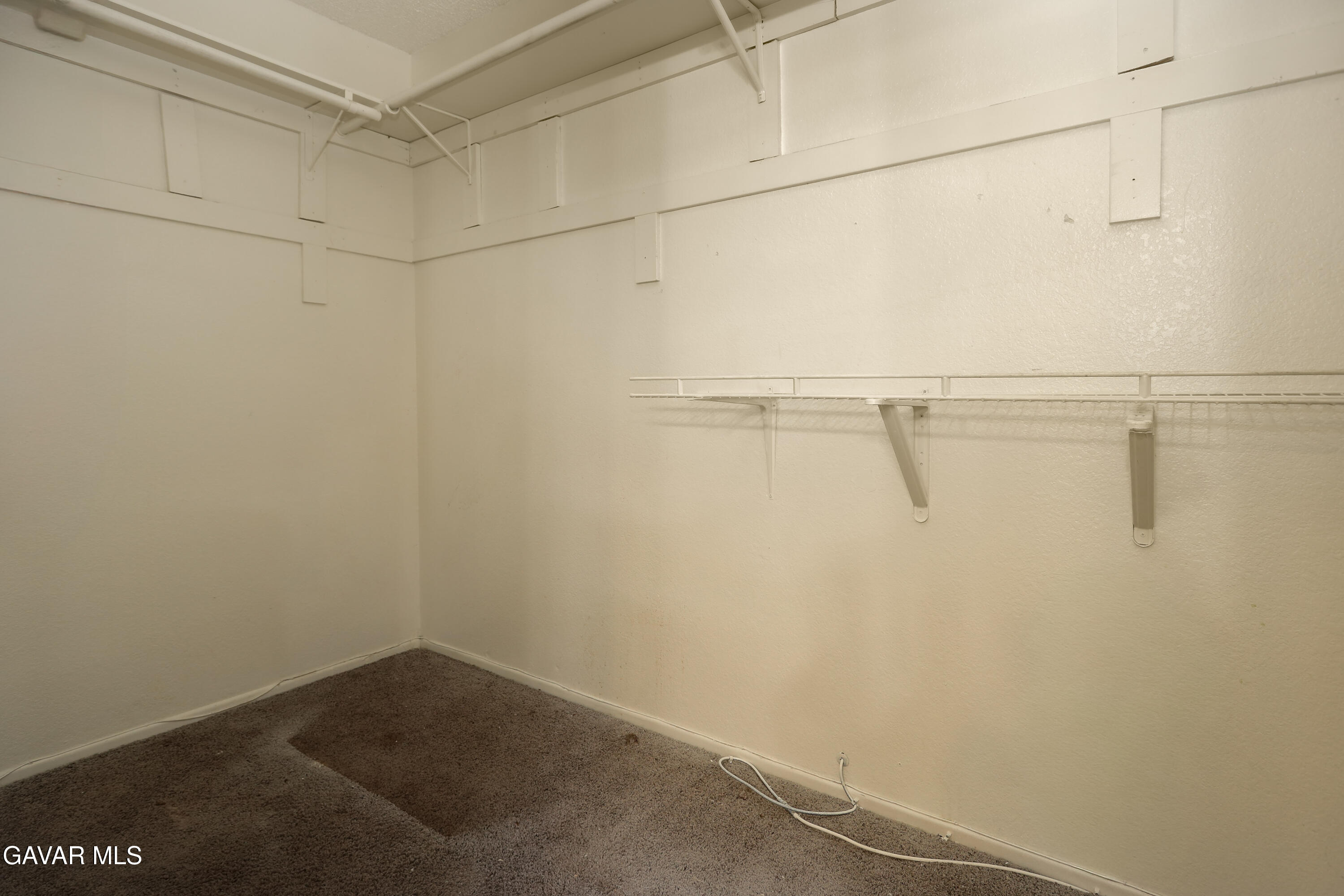 5217 East Ave R 4 Palmdale, CA 93552 - Photo 22 of 33 a view of a room with racks on the wall