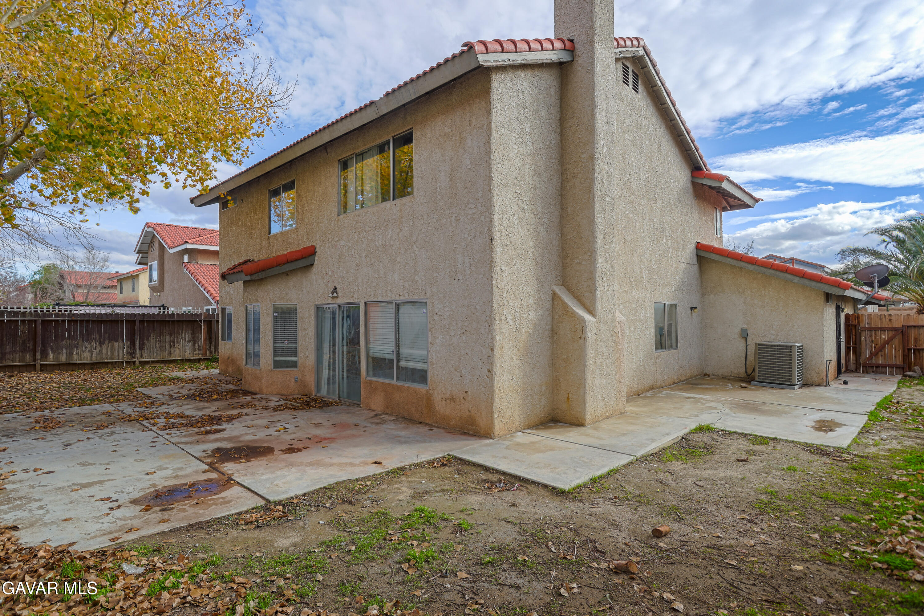 5217 East Ave R 4 Palmdale, CA 93552 - Photo 25 of 33 a front view of a house with a yard