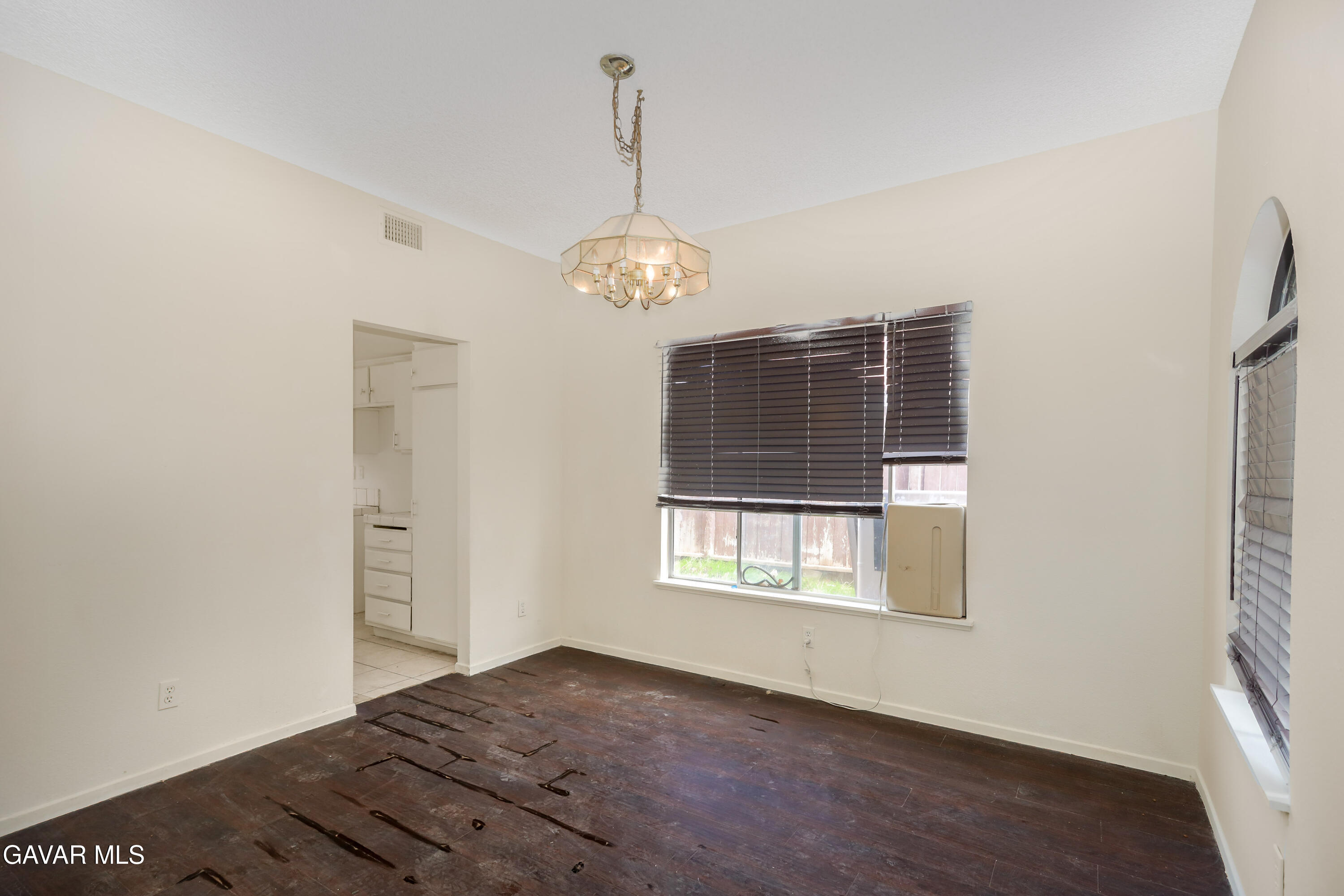 5217 East Ave R 4 Palmdale, CA 93552 - Photo 4 of 33 a view of a room with window and wooden floor