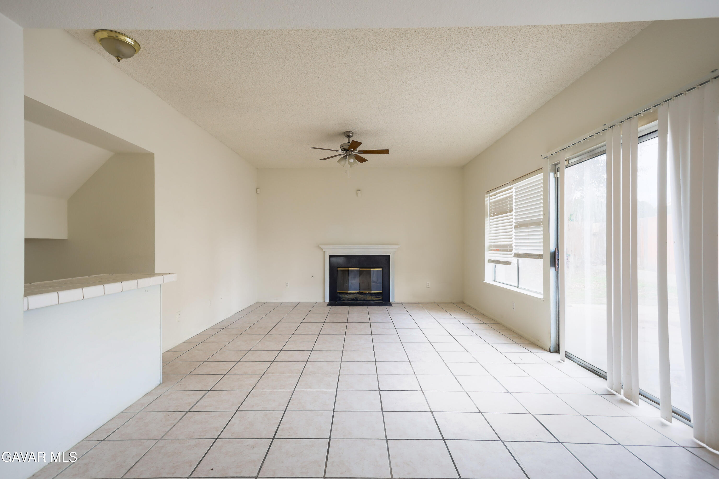 5217 East Ave R 4 Palmdale, CA 93552 - Photo 7 of 33 a view of an empty room with a window