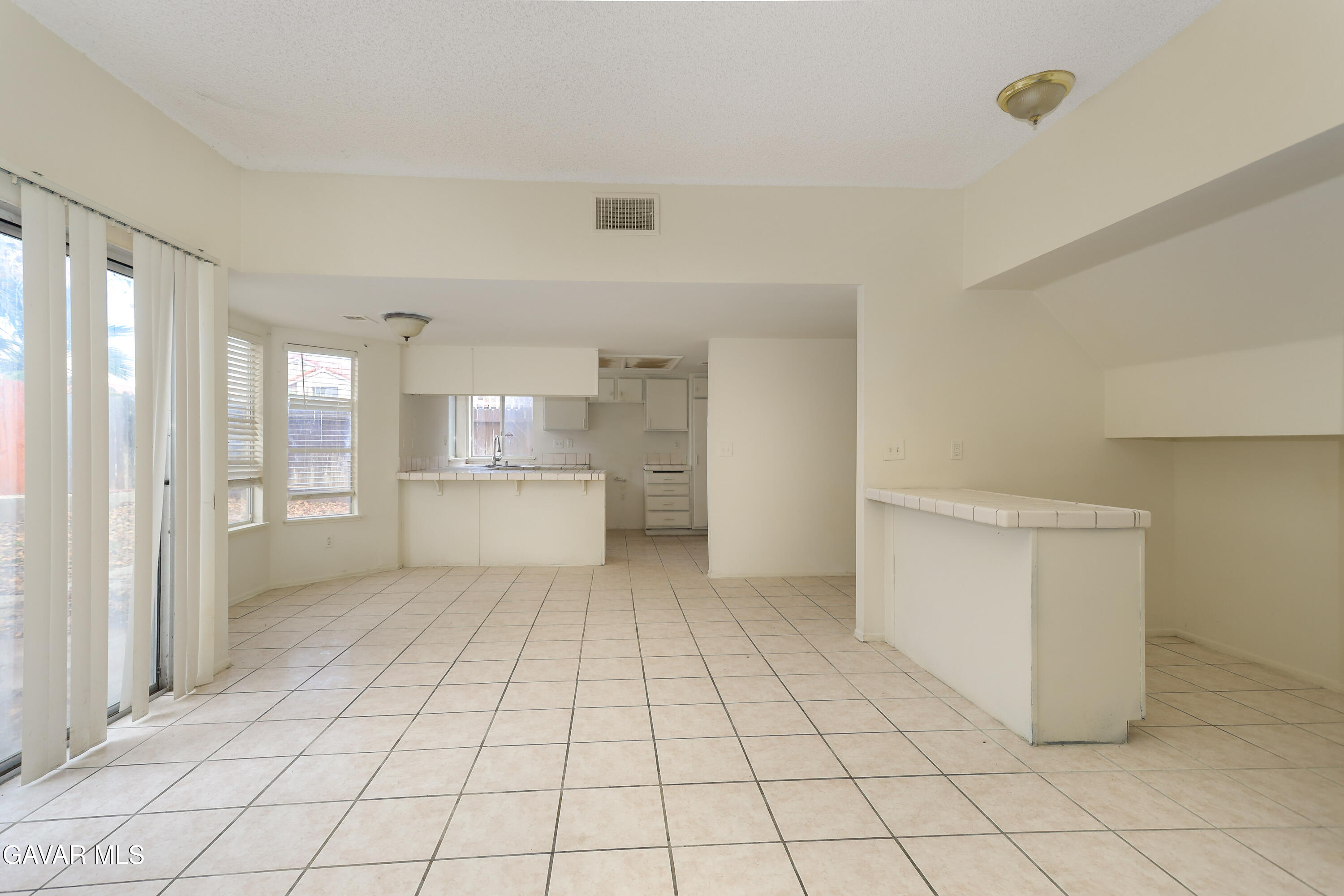 5217 East Ave R 4 Palmdale, CA 93552 - Photo 9 of 33 a view of a kitchen with white cabinets