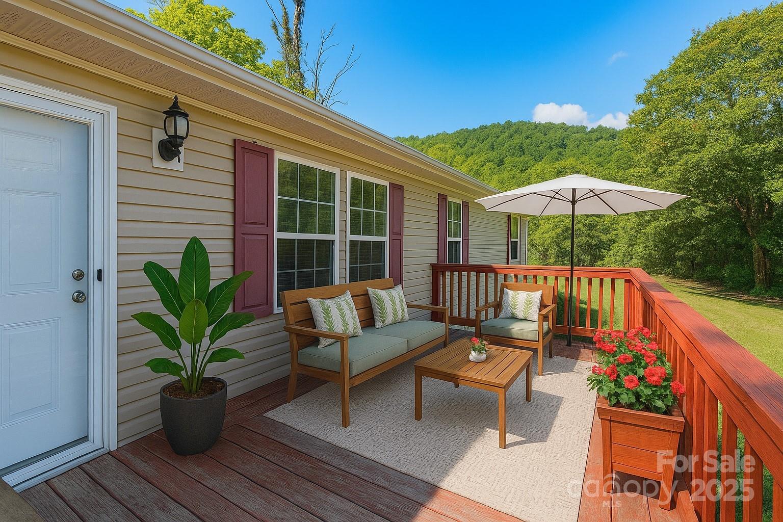 a view of a two chairs with a potted plant on a deck