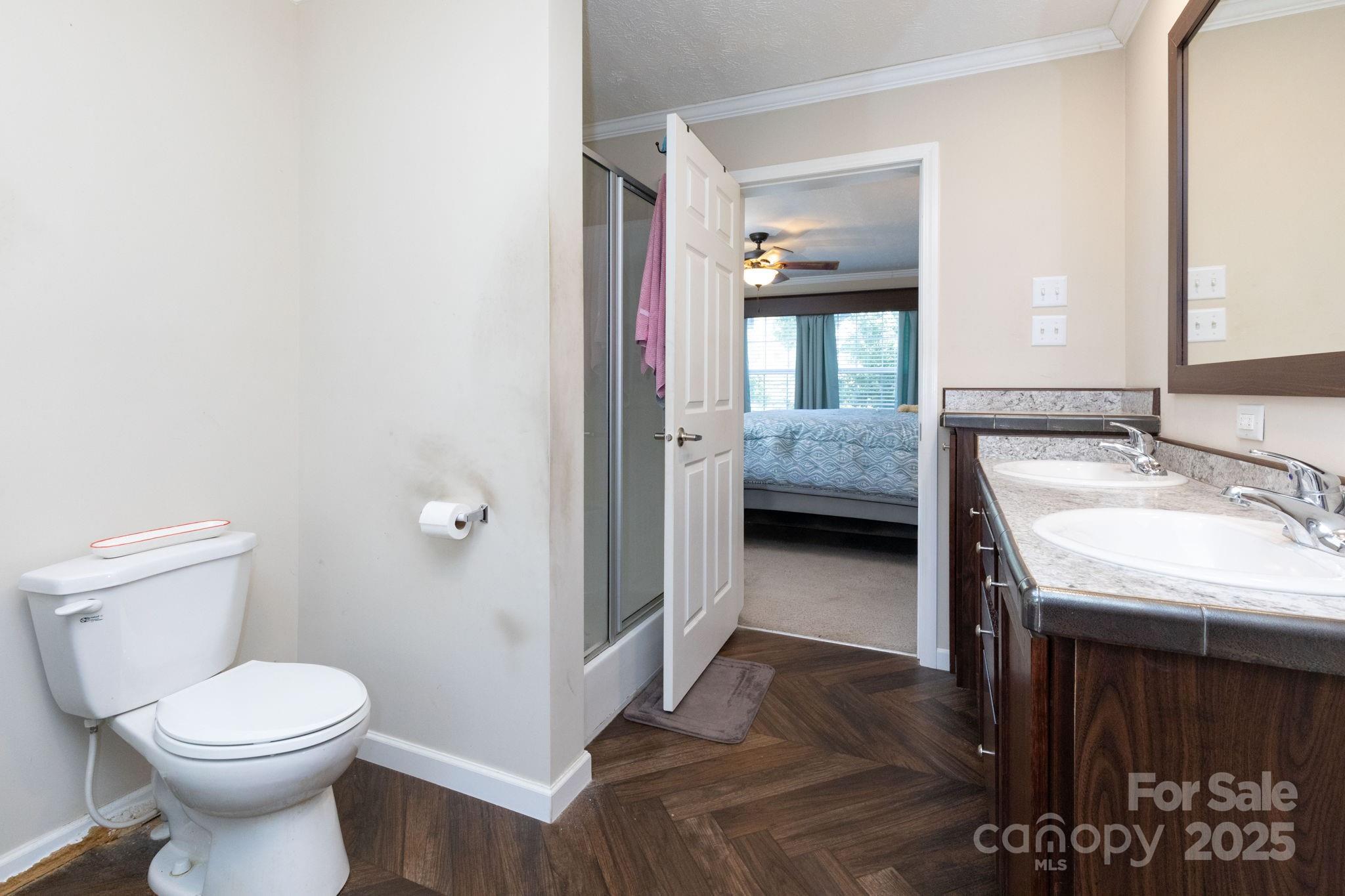 324 Lytle Cove Road Swannanoa, NC 28778 - Photo 16 of 27 a en suite bathroom with a granite countertop sink and a mirror