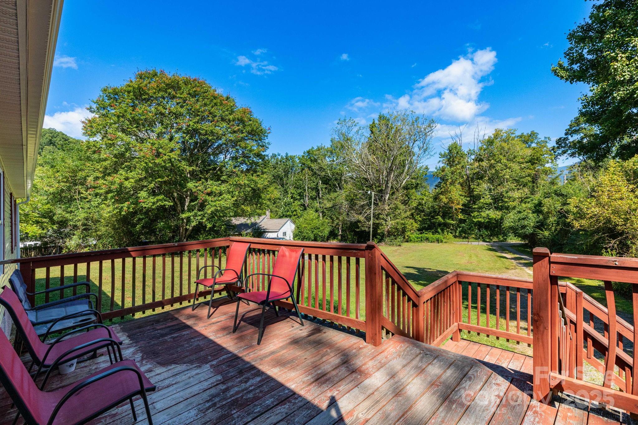 324 Lytle Cove Road Swannanoa, NC 28778 - Photo 5 of 27 a view of sitting area on roof deck with wooden floor and fence