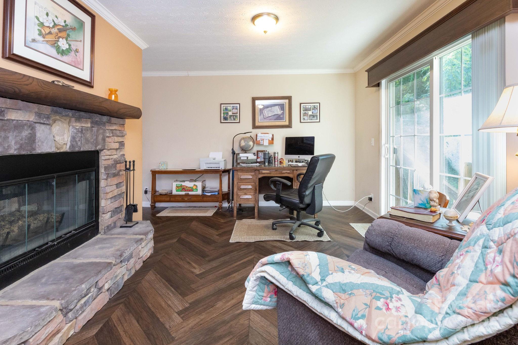 324 Lytle Cove Road Swannanoa, NC 28778 - Photo 9 of 27 a living room with furniture and a fireplace