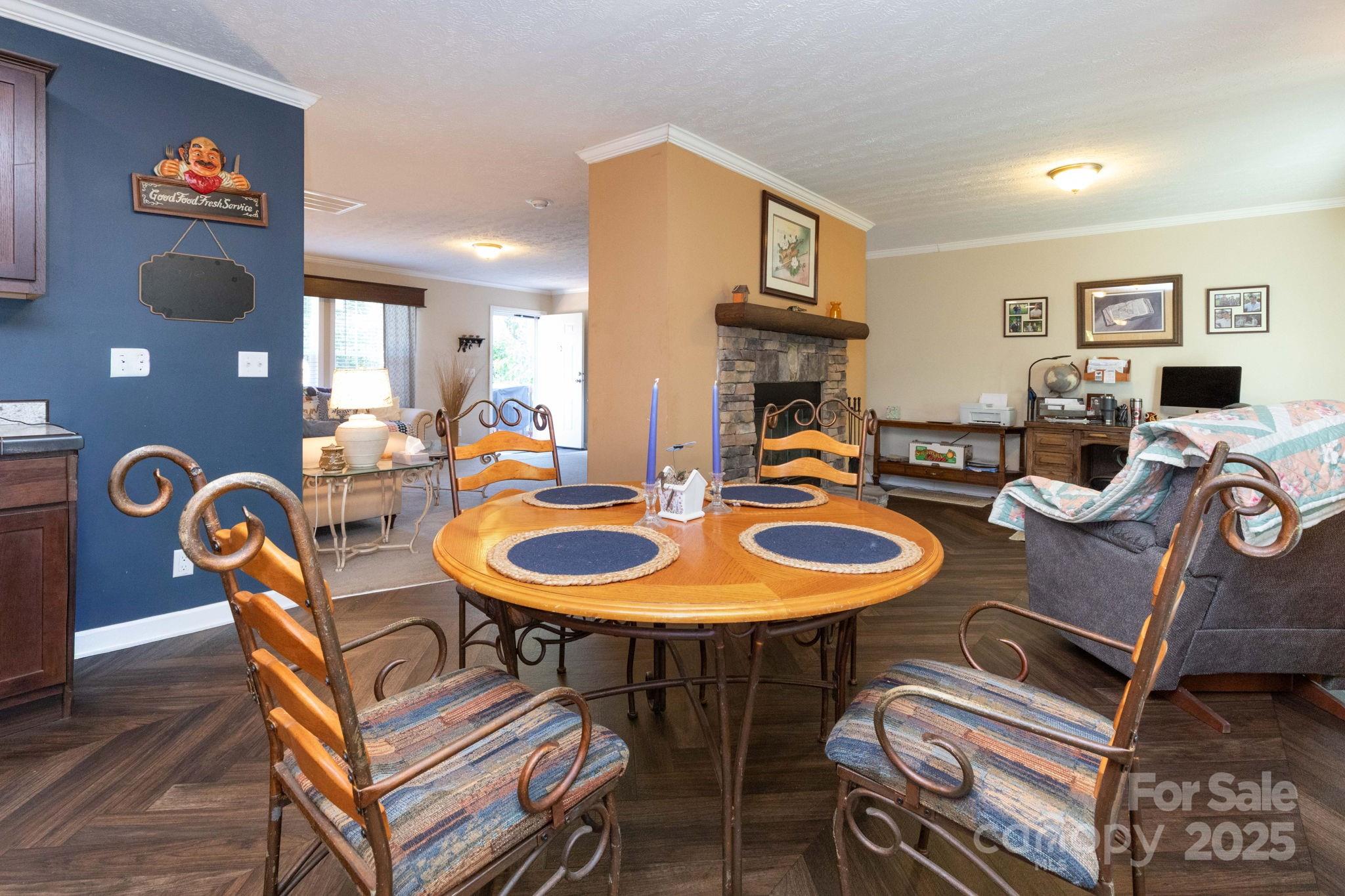 324 Lytle Cove Road Swannanoa, NC 28778 - Photo 10 of 27 a dining room with furniture and wooden floor