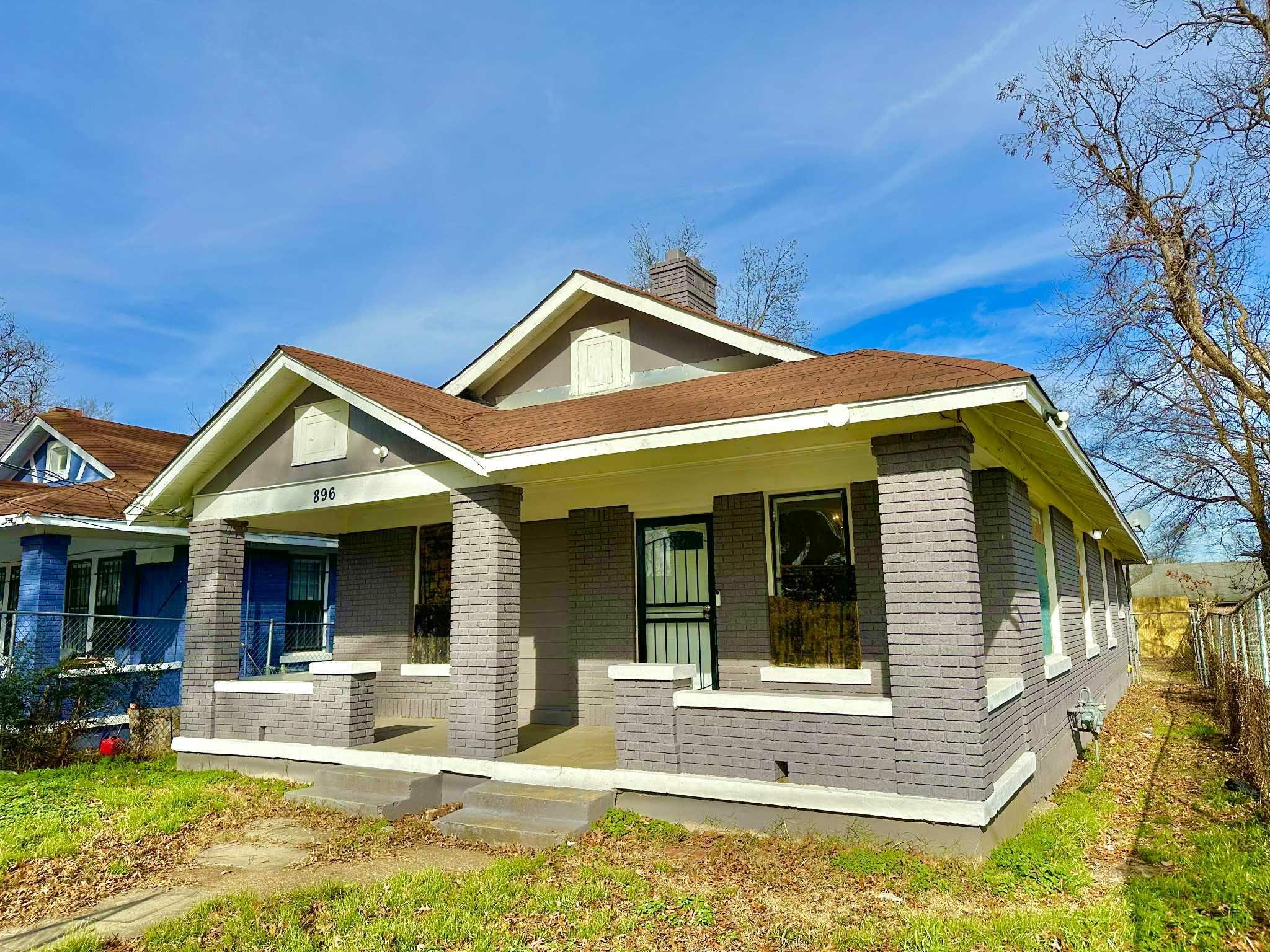 896 Orphanage Avenue Memphis, TN 38107 - Photo 2 of 17 Bungalow-style house with a porch, brick siding, and a chimney