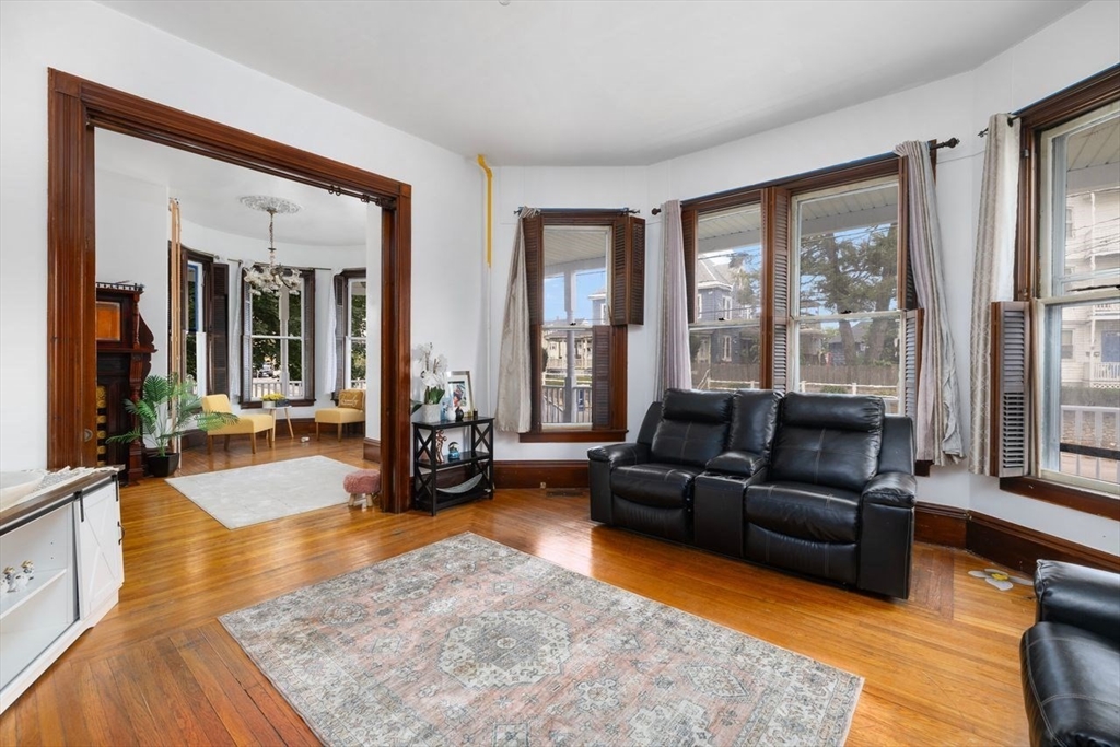 311 Elm Street Woonsocket, RI 02895 - Photo 7 of 29 a living room with furniture and a large window