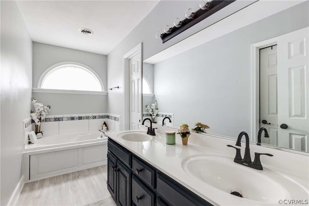 15220 Windy Ridge Road Midlothian, VA 23112 - Photo 33 of 45 The primary bathroom has been updated and features