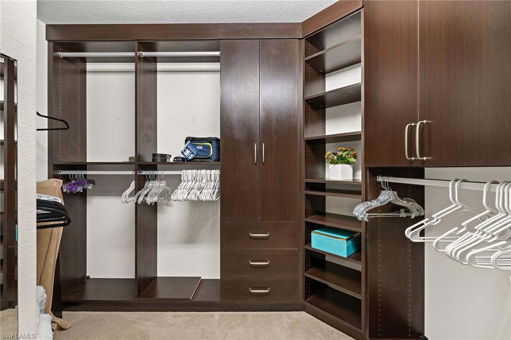 6669 Alden Woods Circle, Unit 7201 Naples, FL 34113 - Photo 18 of 28 a view of walk in closet