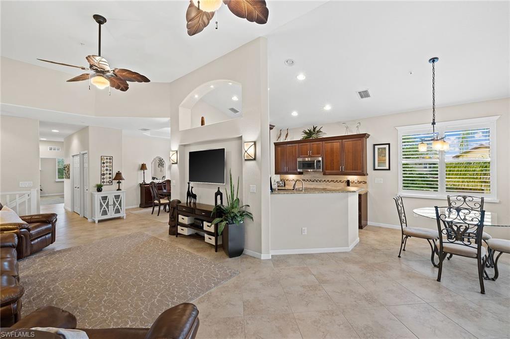 6669 Alden Woods Circle, Unit 7201 Naples, FL 34113 - Photo 7 of 28 a view of kitchen with furniture and window