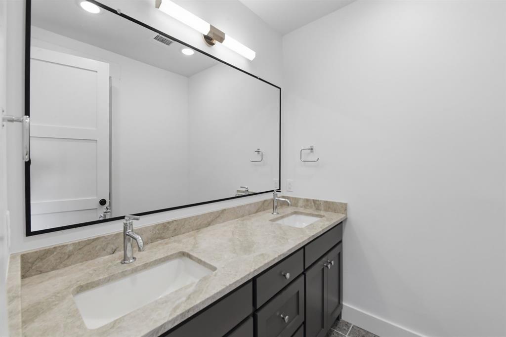 2025 Limestone Trail Graford, TX 76449 - Photo 15 of 33 a bathroom with a granite countertop sink and a mirror