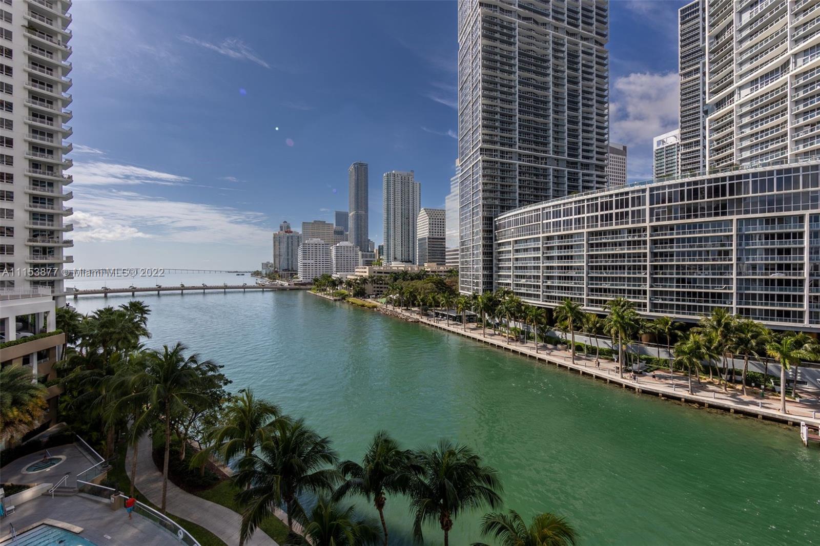 a view of a lake with tall buildings