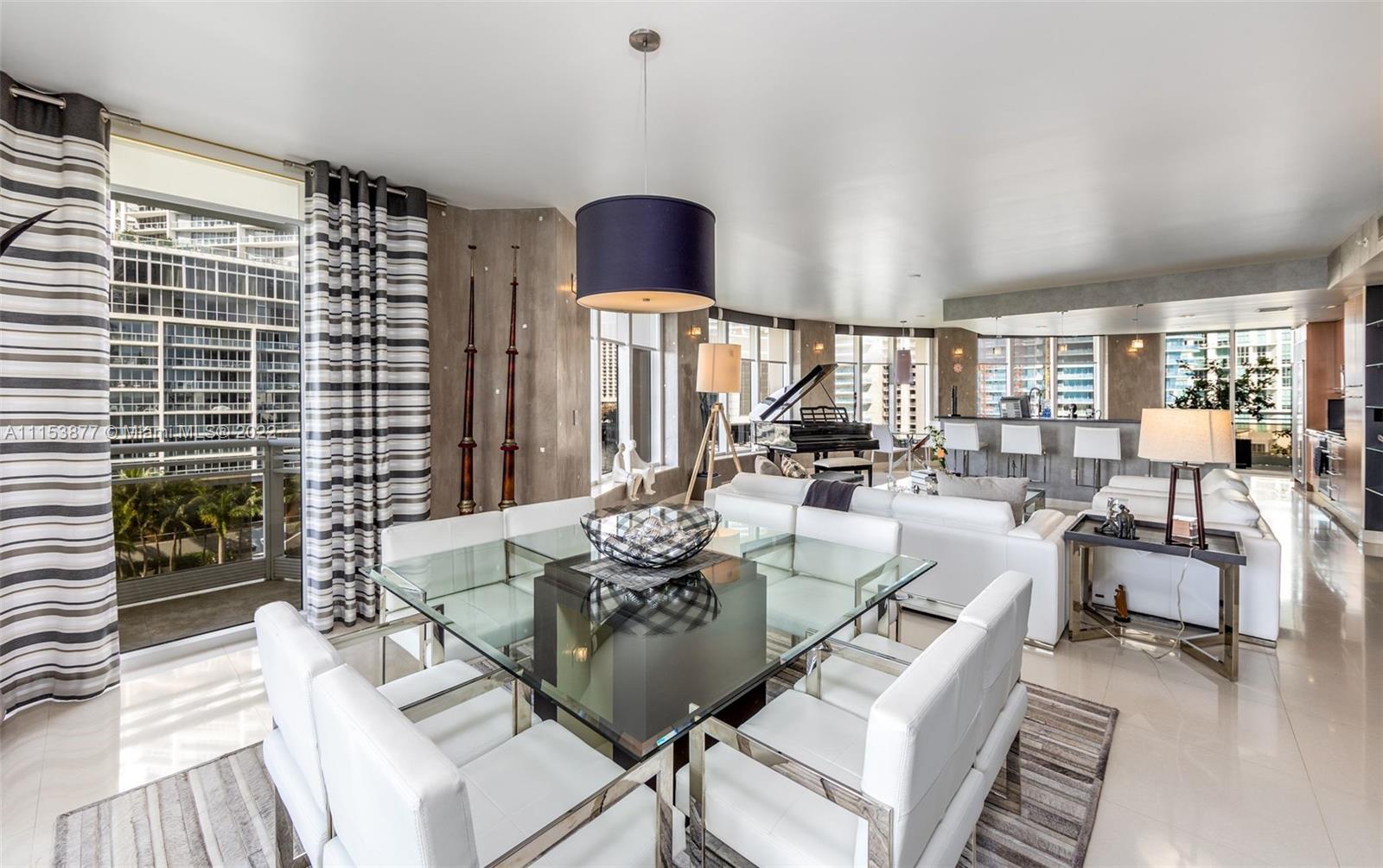 901 Brickell Key Boulevard, Unit 704 Miami, FL 33131 - Photo 3 of 39 a view of a dining room with furniture window and outside view