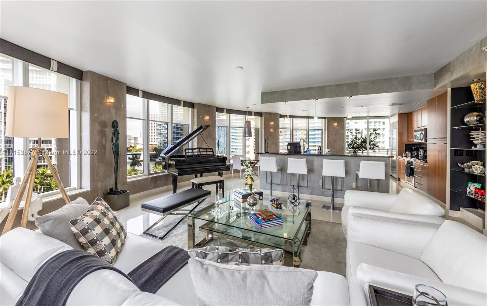 901 Brickell Key Boulevard, Unit 704 Miami, FL 33131 - Photo 4 of 39 a living room with furniture floor to ceiling window and floor to ceiling window