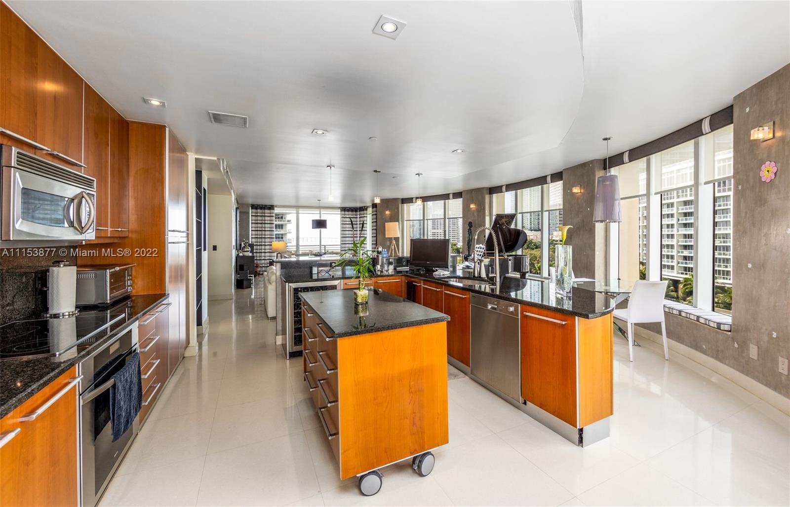 901 Brickell Key Boulevard, Unit 704 Miami, FL 33131 - Photo 6 of 39 a living room with stainless steel appliances granite countertop furniture and a kitchen view
