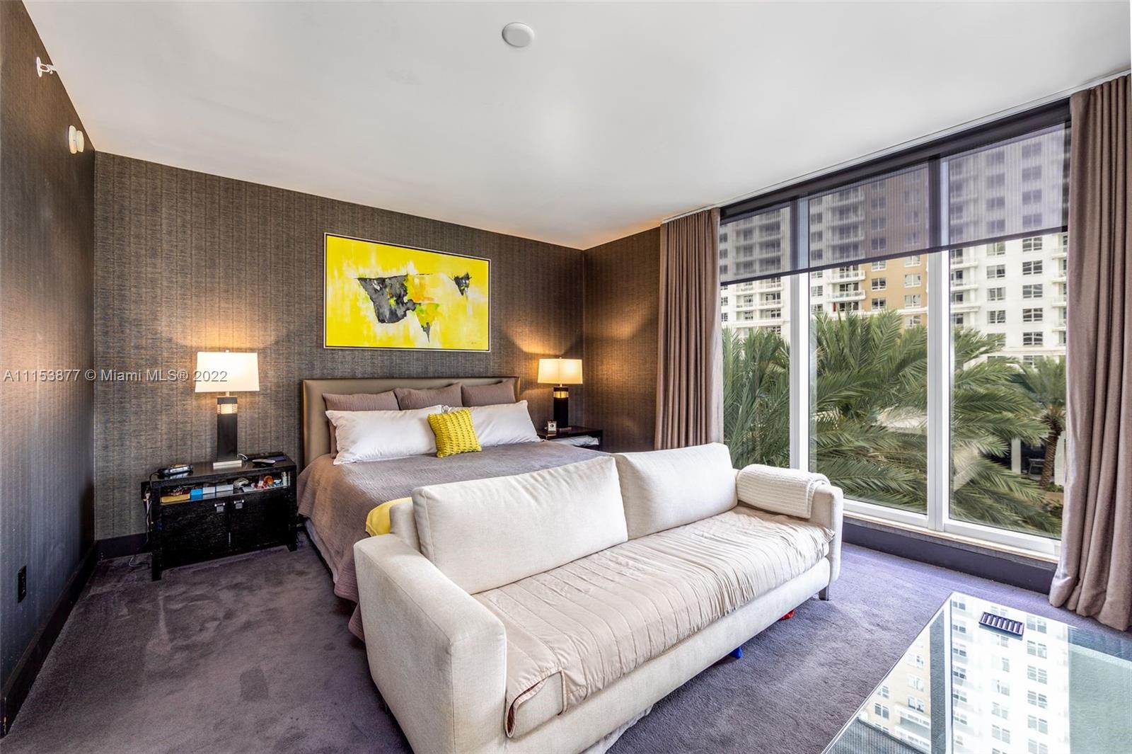 901 Brickell Key Boulevard, Unit 704 Miami, FL 33131 - Photo 9 of 39 a bedroom with a bed and a large window