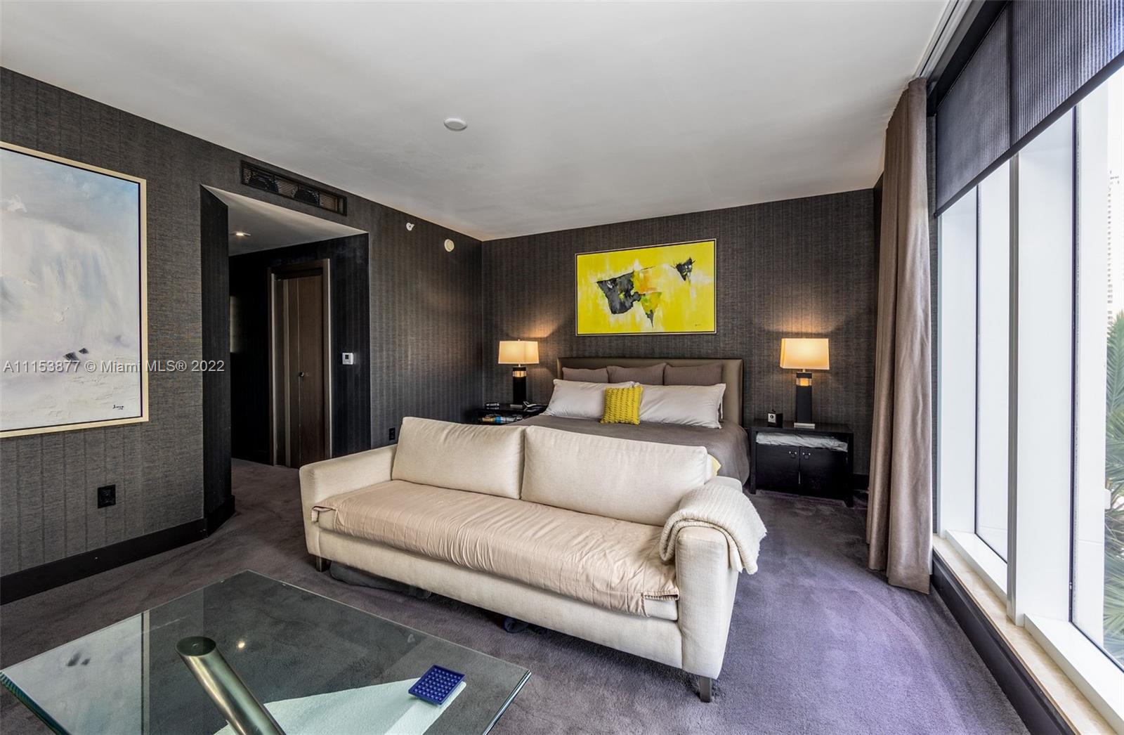 901 Brickell Key Boulevard, Unit 704 Miami, FL 33131 - Photo 10 of 39 a living room with furniture and a flat screen tv