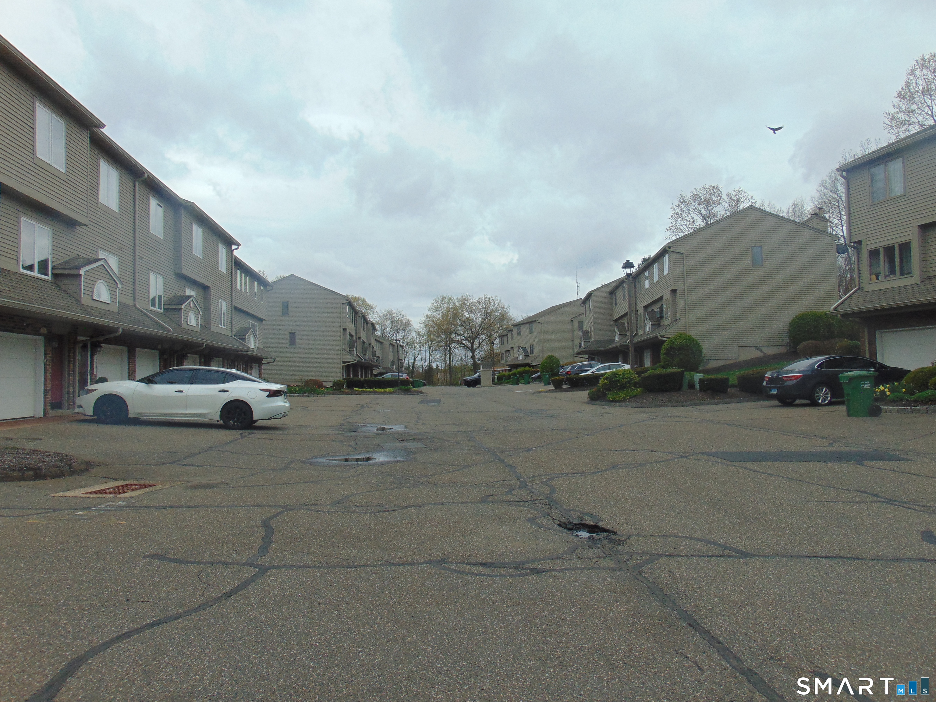 882 North Colony Road, Unit 31 Meriden, CT 06450 - Photo 4 of 34 a view of building with car parked on the road