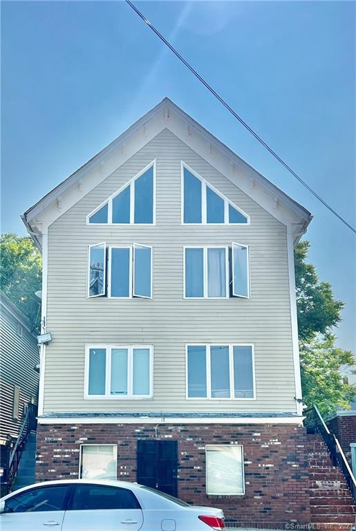 a front view of a house with glass windows