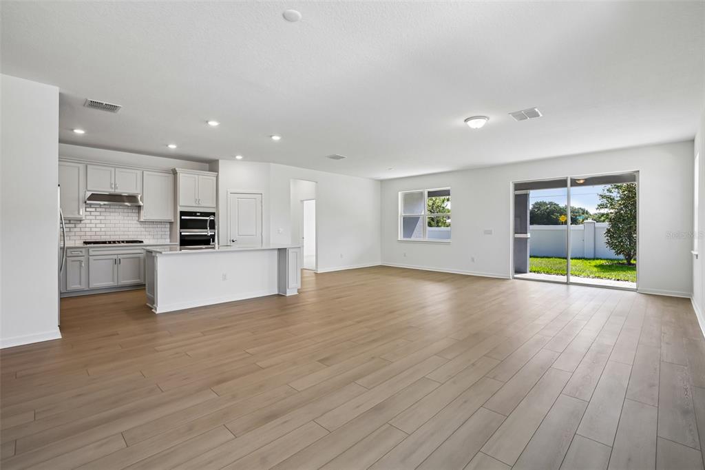 9932 Redwood Rdg Avenue Riverview, FL 33578 - Photo 12 of 38 a view of kitchen with cabinets and wooden floor