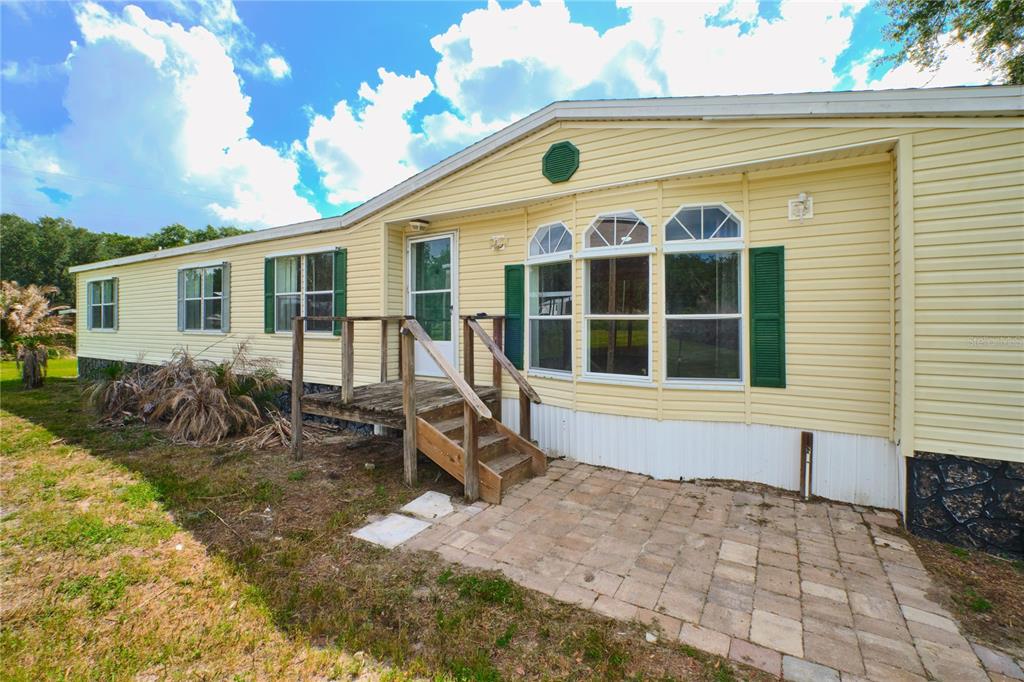 2701 Murphy Road Ona, FL 33865 - Photo 2 of 41 a front view of a house with large windows