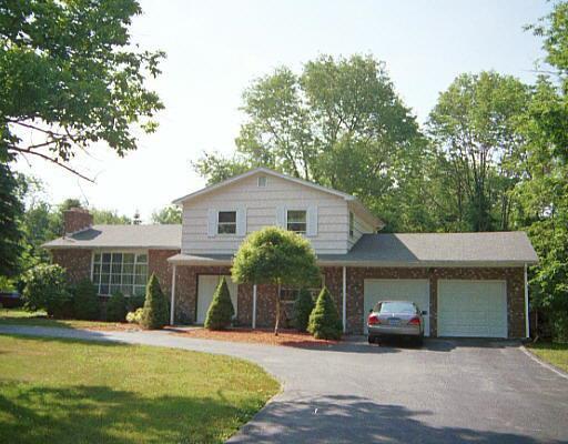 337 Purdy Hill Road Monroe, CT 06468 - Photo 1 of 1 a front view of a house with a yard and garage