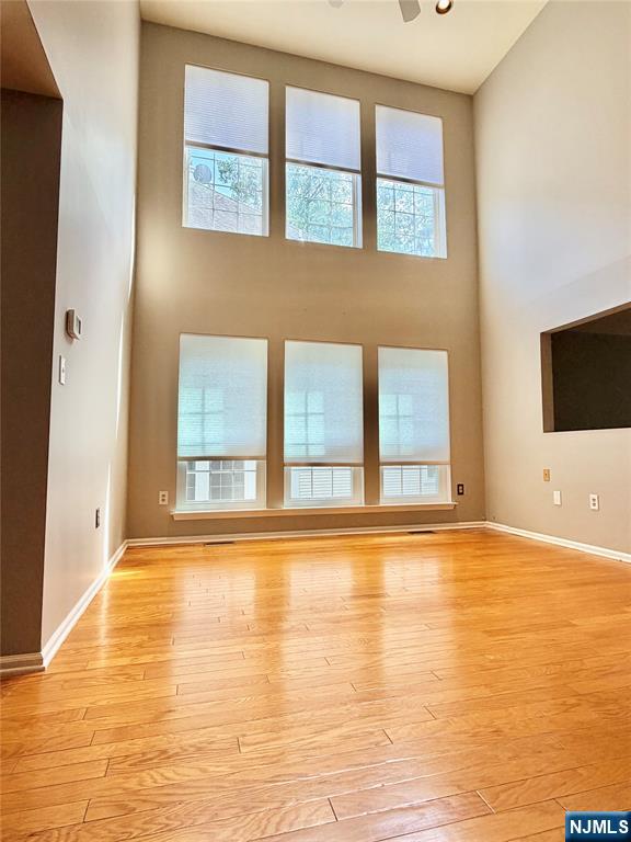 35 Harrier Court, Unit 35 Wayne, NJ 07470 - Photo 4 of 16 a view of an empty room with window and a kitchen