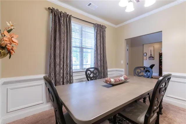 a dining room with furniture and window