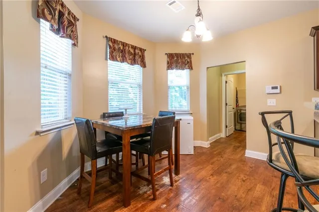 a view of a dining room with furniture and window