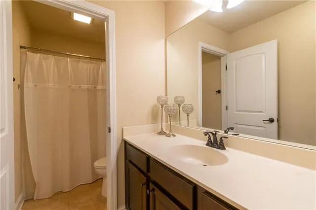 a bathroom with a sink double vanity and a mirror