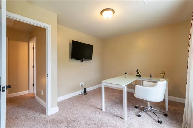 a workspace with a flat screen tv