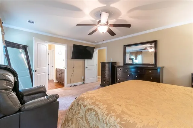 a bed room with a bed and a television