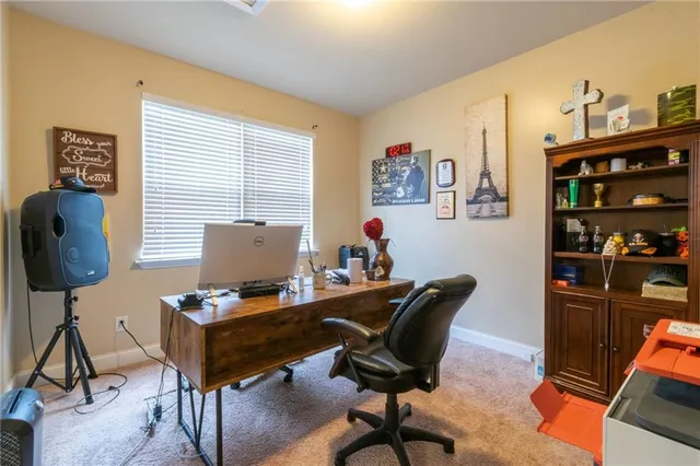 a workspace with furniture and a window