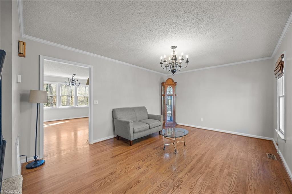 232 Holly Ridge Lane Mebane, NC 27302 - Photo 2 of 45 Spacious Living Room with hardwood floors.