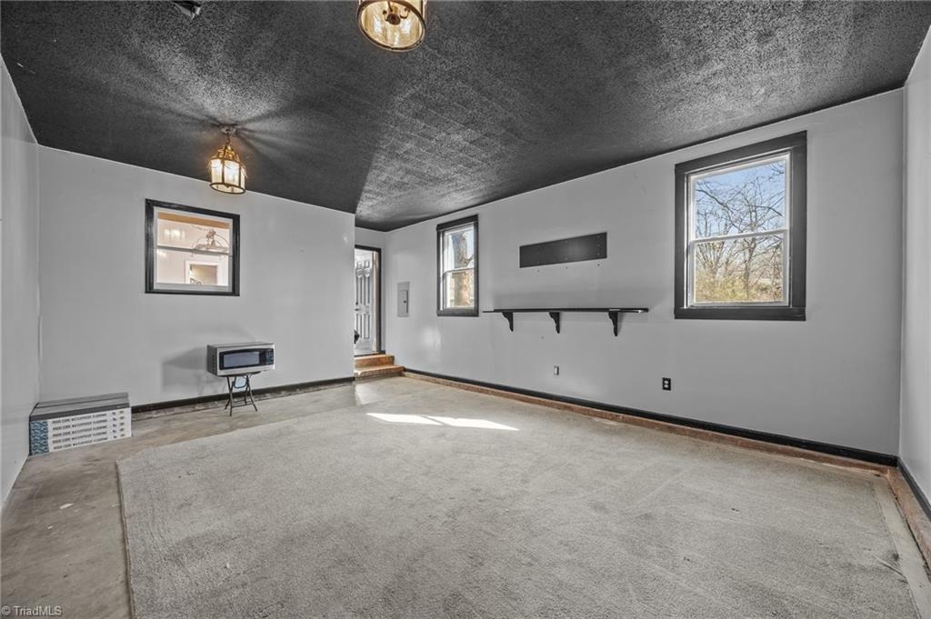 232 Holly Ridge Lane Mebane, NC 27302 - Photo 28 of 45 Perfect space for football parties or relaxing weekends.