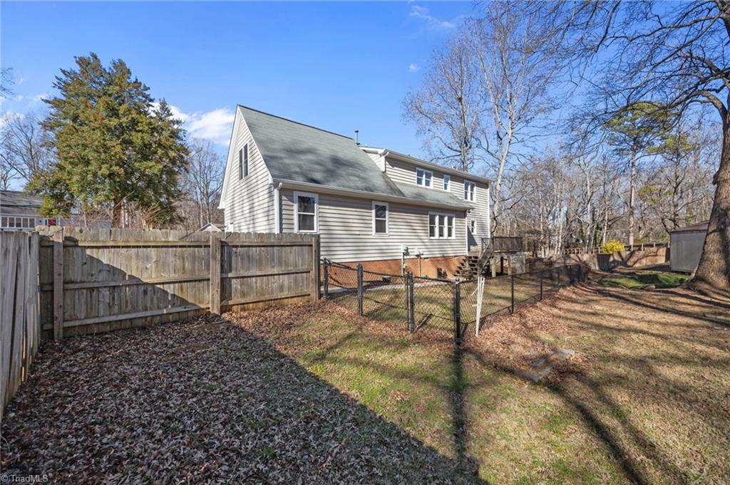 232 Holly Ridge Lane Mebane, NC 27302 - Photo 40 of 45 Partially fenced backyard