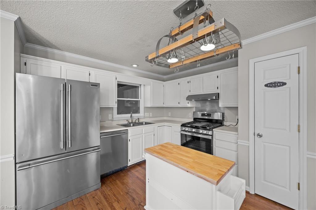 232 Holly Ridge Lane Mebane, NC 27302 - Photo 9 of 45 Pot Rack over Kitchen Island.