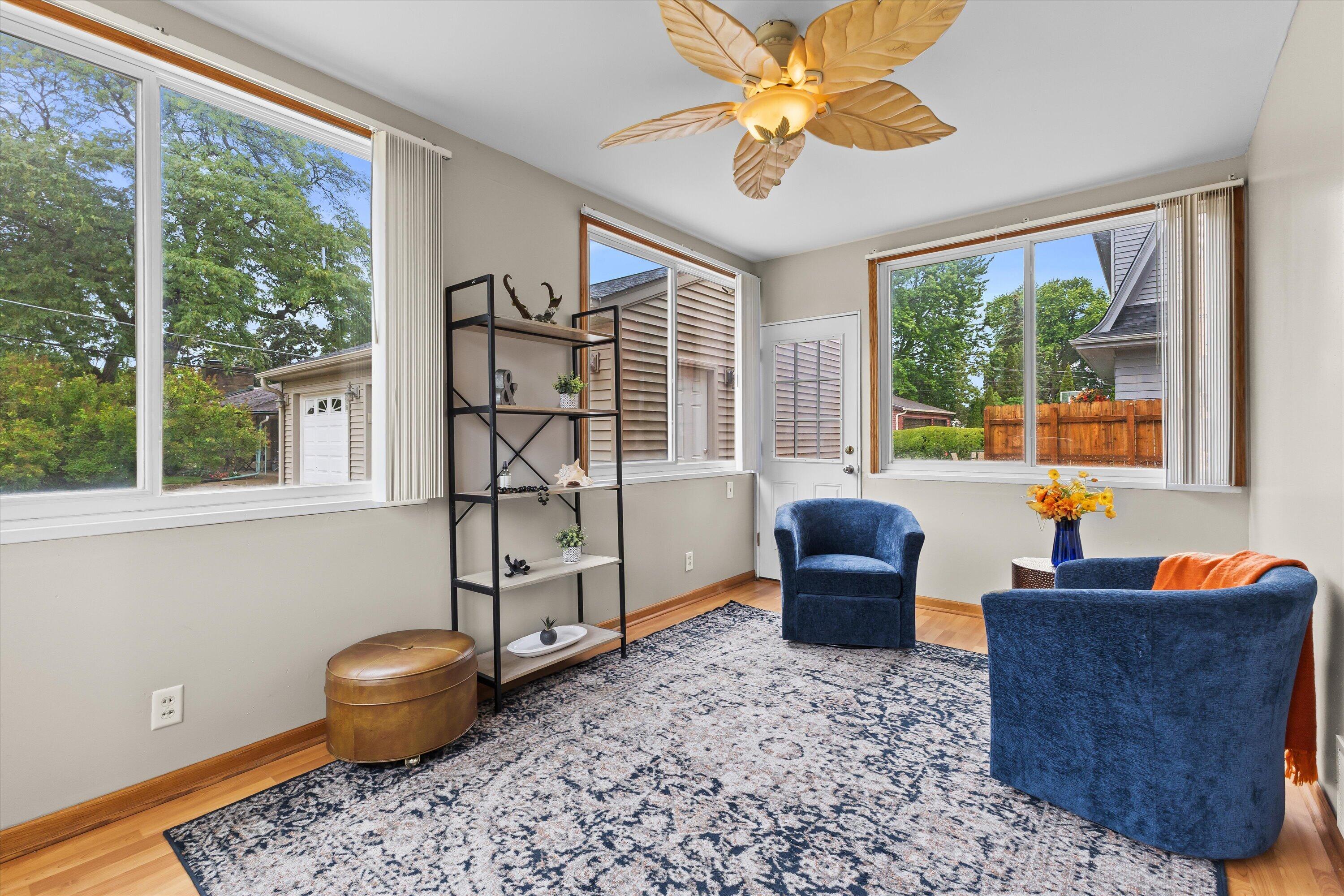 2925 North Main Street Racine, WI 53402 - Photo 4 of 23 Filled with natural light from walls of windows, this versatile space is perfect as a sunroom, reading nook, home office, or casual sitting room.