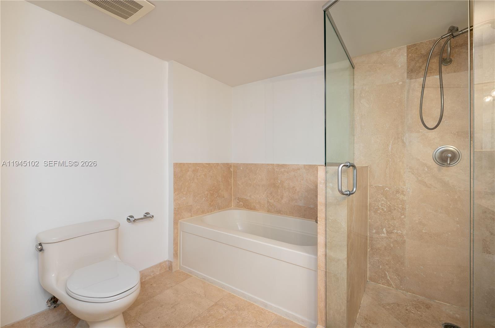 3232 Southwest 22nd Terrace, Unit 1504 Miami, FL 33145 - Photo 16 of 25 a bathroom with a shower and a toilet