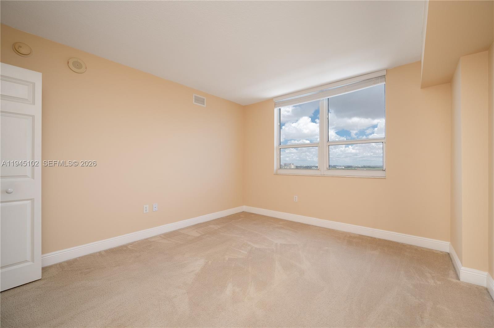 3232 Southwest 22nd Terrace, Unit 1504 Miami, FL 33145 - Photo 19 of 25 an empty room with windows