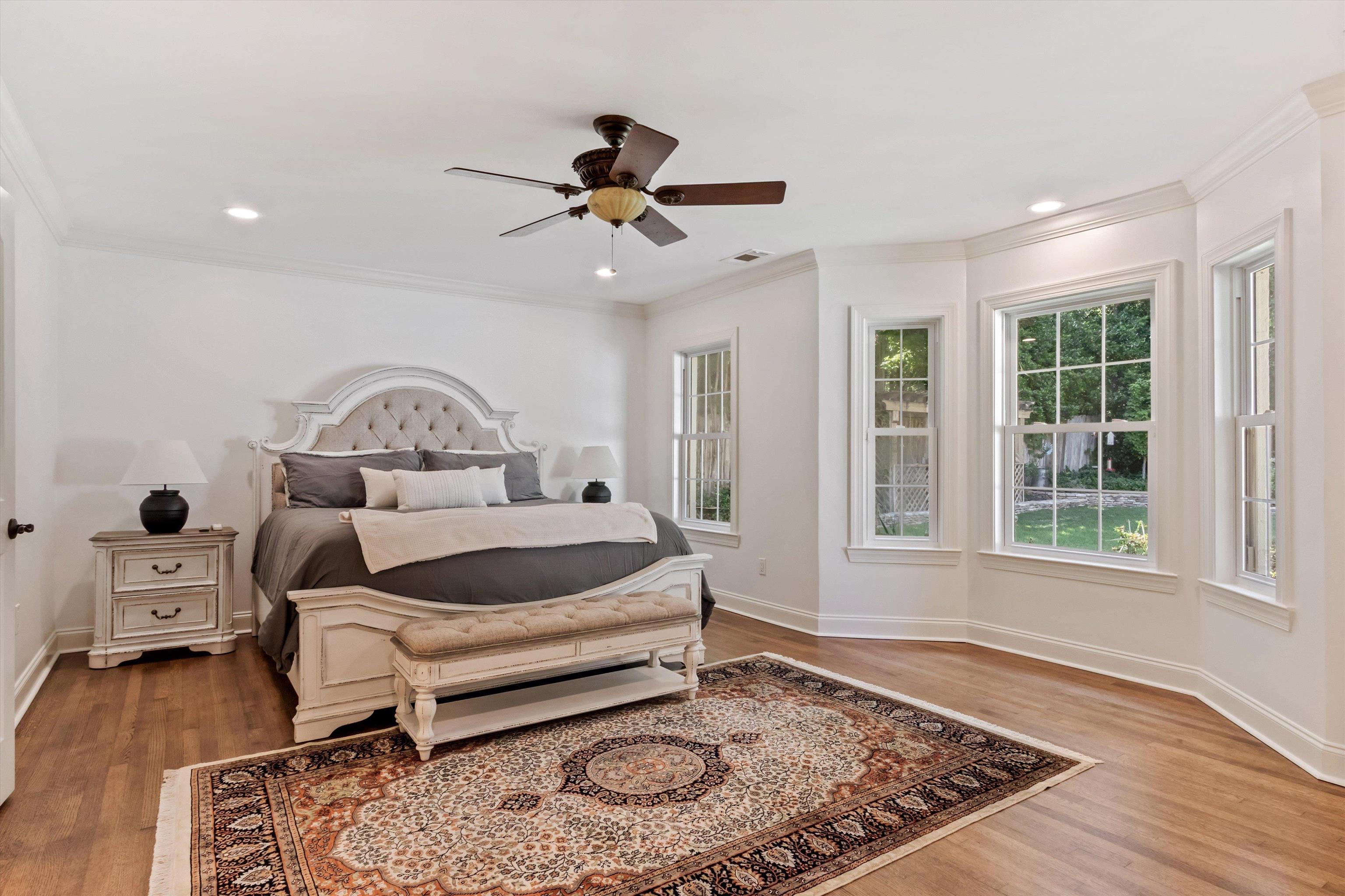 5302 South Angela Road Memphis, TN 38120 - Photo 19 of 40 Hardwood flooring extends throughout this room, featuring a bay window with multiple paneled windows