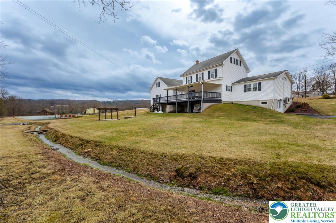 181 Springhouse Road Lehighton, PA 18235 - Photo 17 of 71 a view of a big house with a big yard and large trees