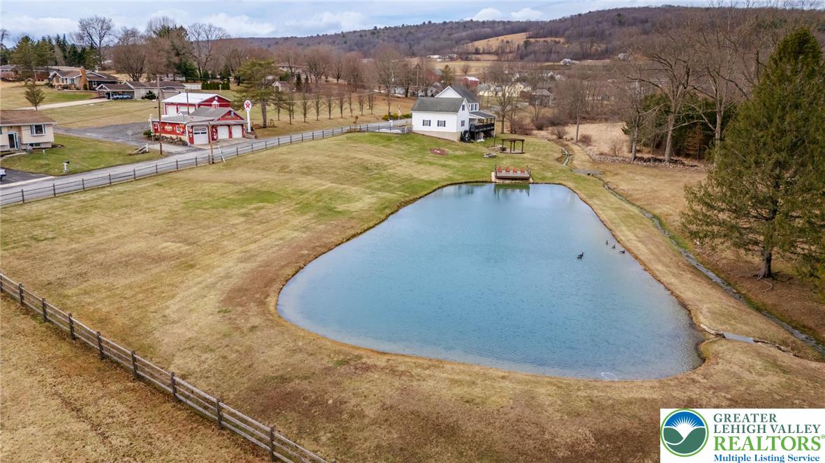 181 Springhouse Road Lehighton, PA 18235 - Photo 2 of 71 a view of a swimming pool with a lake view