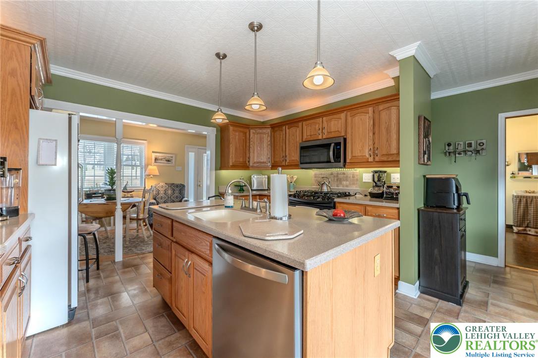 181 Springhouse Road Lehighton, PA 18235 - Photo 31 of 71 a kitchen with stainless steel appliances granite countertop a sink a stove and a refrigerator