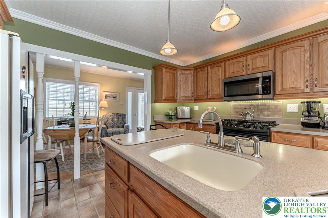 181 Springhouse Road Lehighton, PA 18235 - Photo 32 of 71 a kitchen with stainless steel appliances granite countertop a sink a stove and a refrigerator
