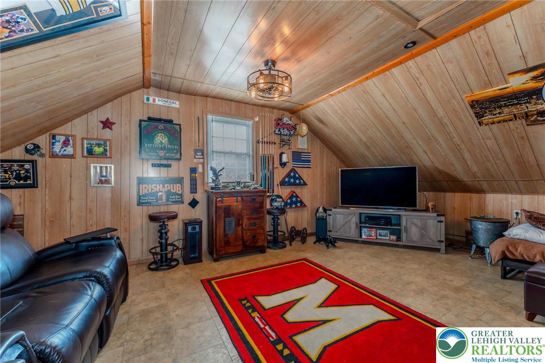 181 Springhouse Road Lehighton, PA 18235 - Photo 60 of 71 a living room with furniture a flat screen tv and kitchen view