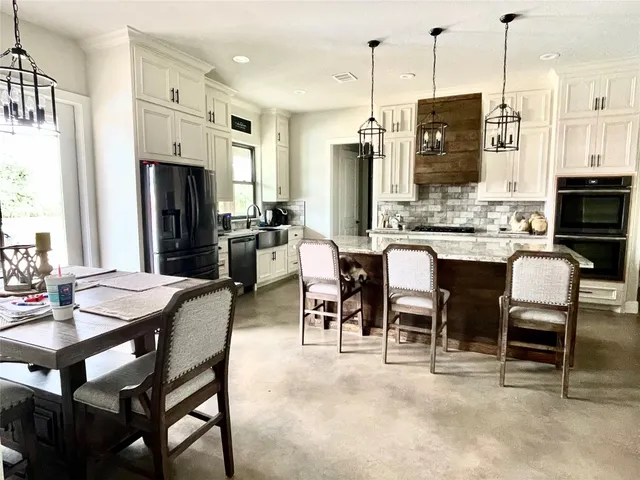 a view of a dining room kitchen livingroom and furniture