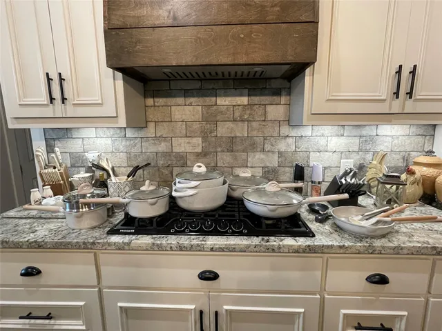 a living room with a fireplace and a flat screen tv