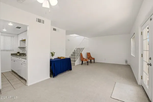 a view of workspace with furniture and wooden floor